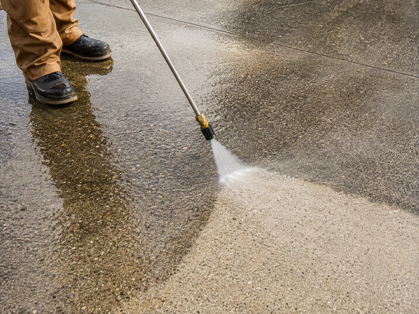 Pressure washing a paved exterior surface